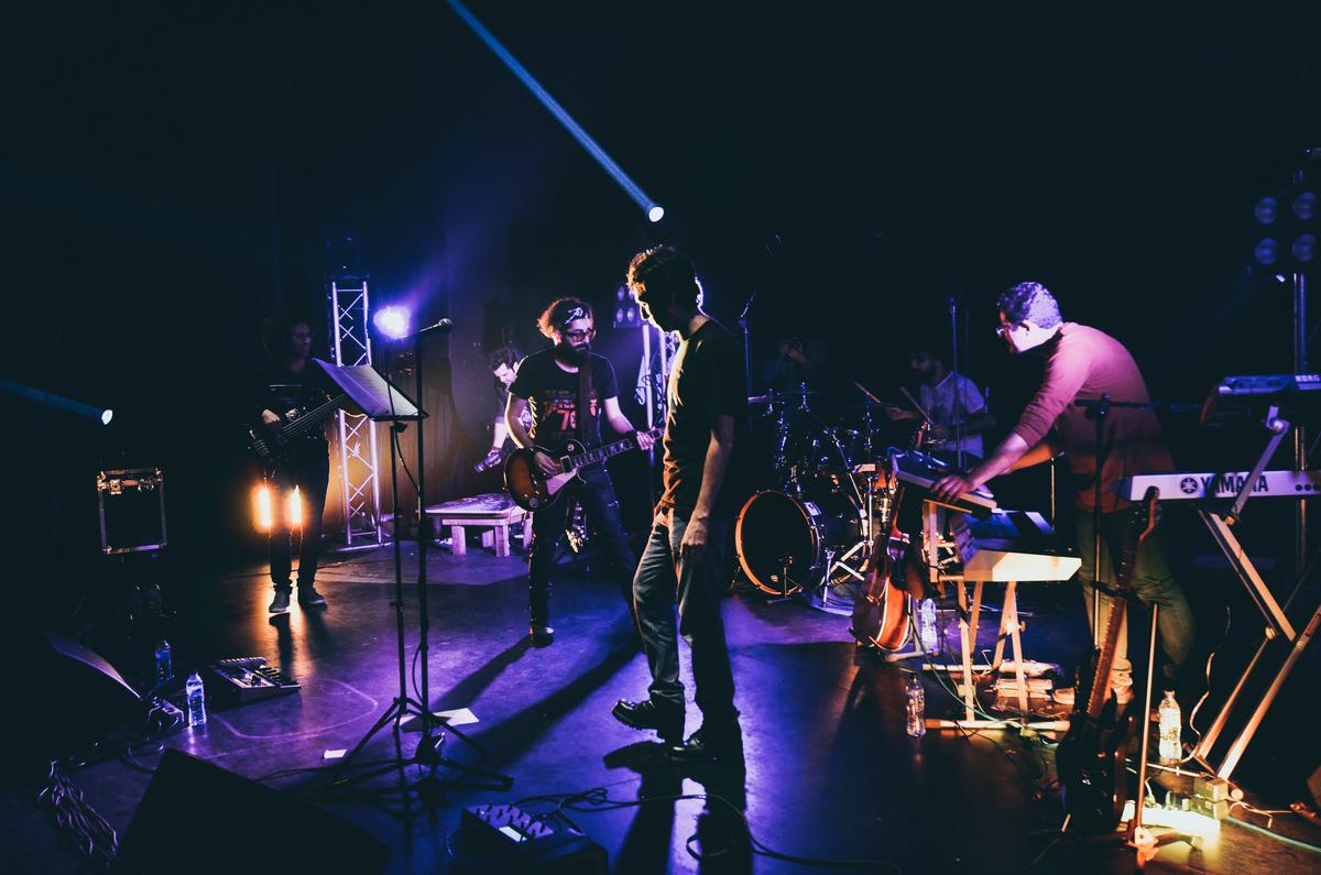 Image of musicians playing cumbia mexicana, creating a lively and energetic atmosphere.