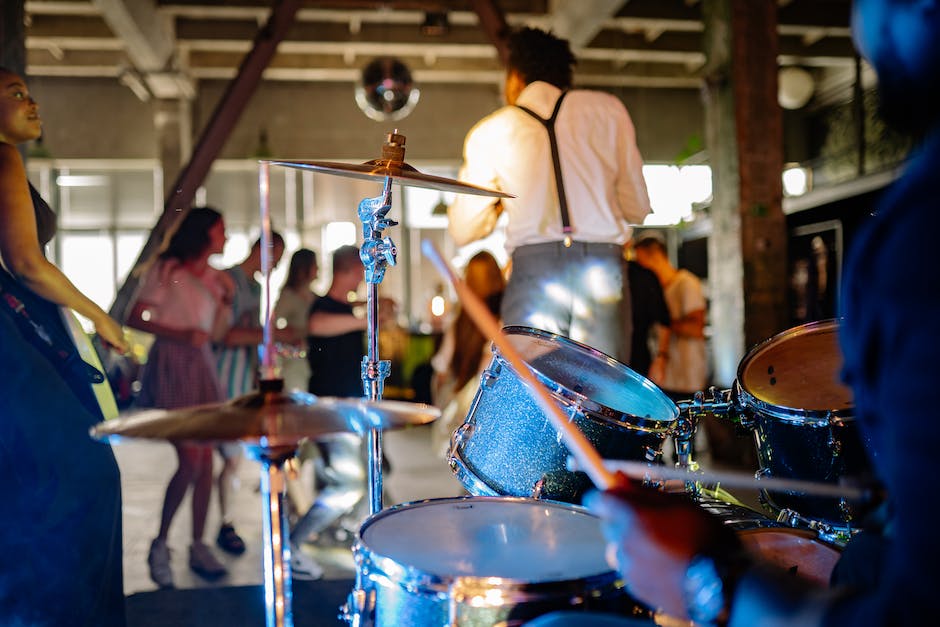 Image description: A mariachi band performing with people dancing and enjoying the music.