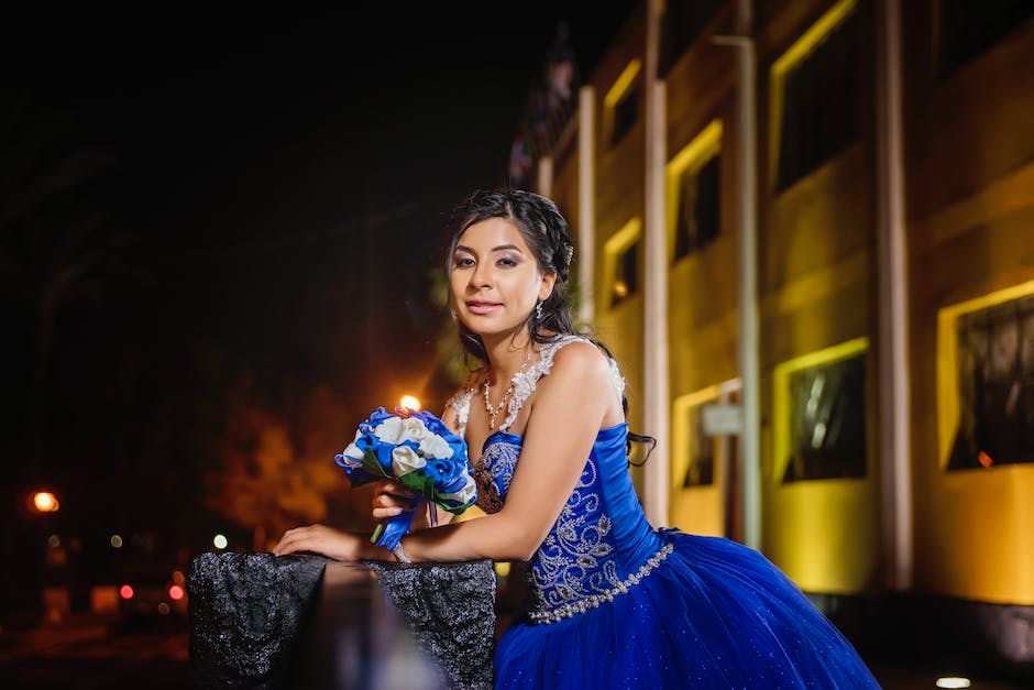 Image of a quinceañera dancing with colorful lights in the background, symbolizing the joy and excitement of the celebration.