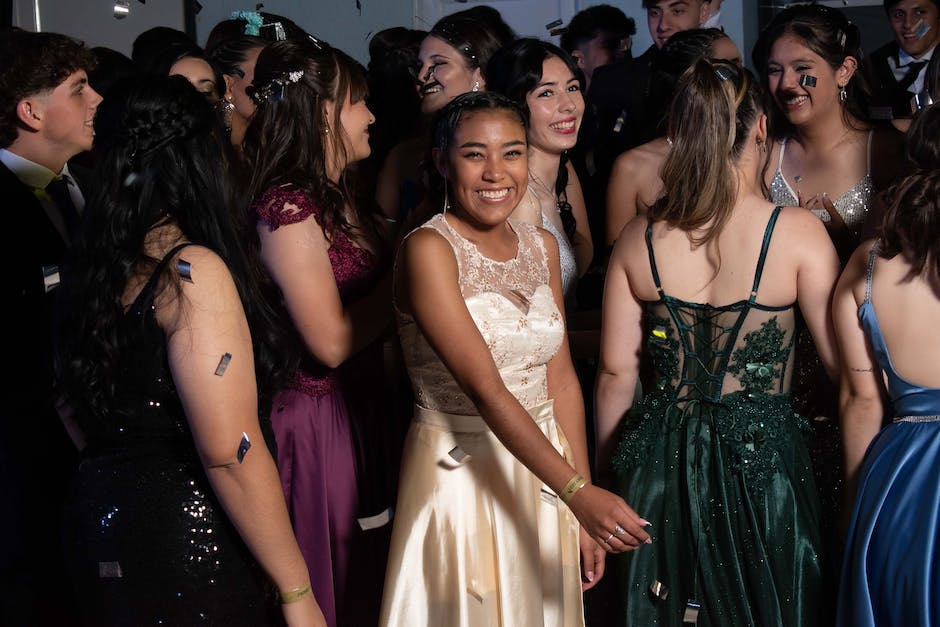 A group of girls celebrating a quinceañera with colorful decorations and a vibrant atmosphere